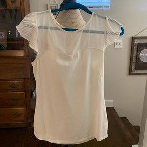 Cream express medium top faux sweetheart neckline.